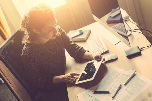 your biz rules small business woman on tablet home page